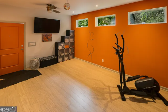 a backyard of a house with table and chairs