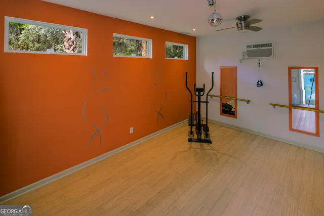 a view of a chair and table in backyard of the house