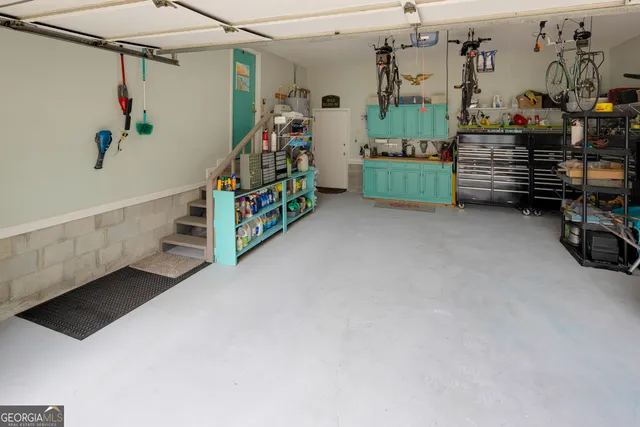a front view of a house with a yard and potted plants