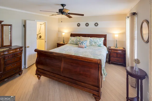 an aerial view of residential houses with outdoor space and trees
