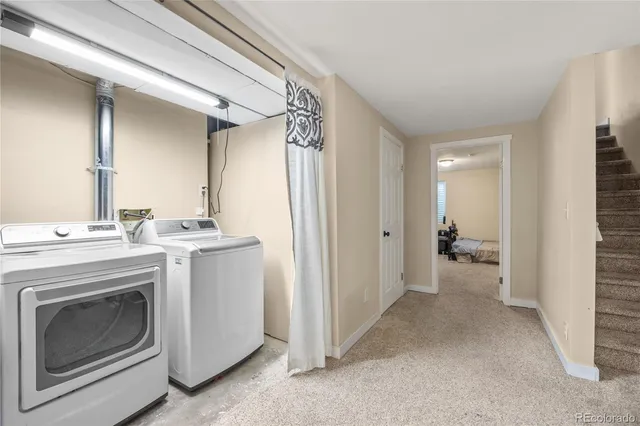 a view of a hallway with washer and dryer
