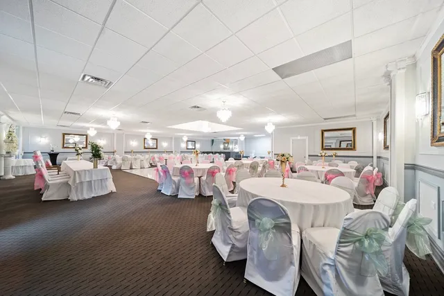 a living room with lots of furniture and white walls