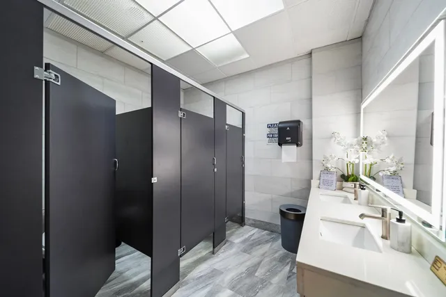 a bathroom with a sink and shower
