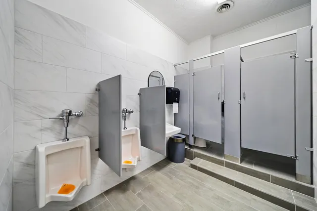 a view of a storage & utility room with two washing machine
