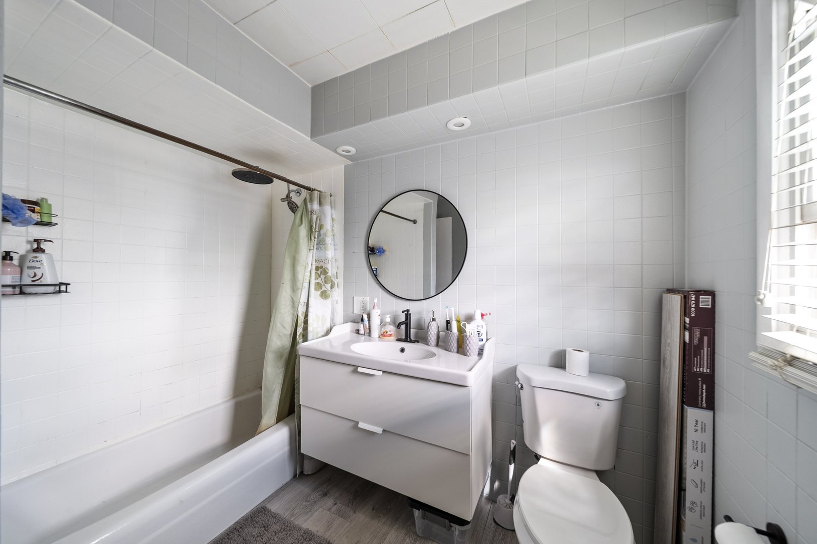 6155 West Fullerton Avenue Chicago, IL 60639 - Photo 28 of 43 a bathroom with a toilet sink and mirror