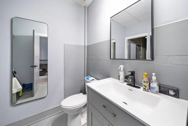 a kitchen with a sink appliances and cabinets