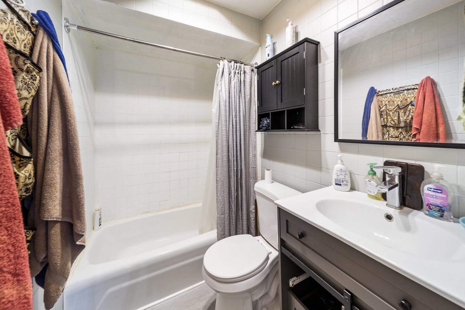 6155 West Fullerton Avenue Chicago, IL 60639 - Photo 35 of 43 a bathroom with a sink toilet and shower