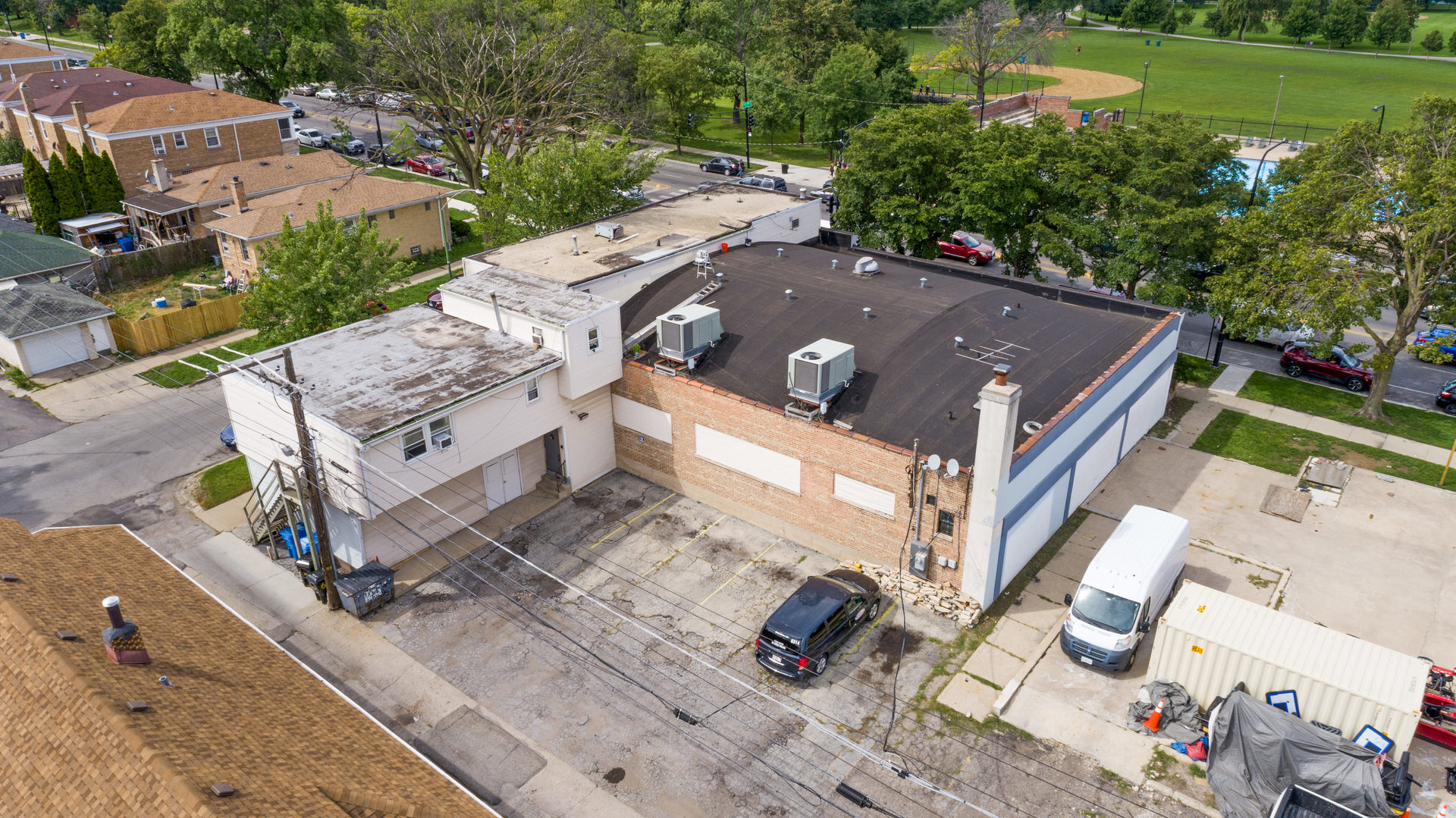 6155 West Fullerton Avenue Chicago, IL 60639 - Photo 36 of 43 an aerial view of a house with a garden and lake view
