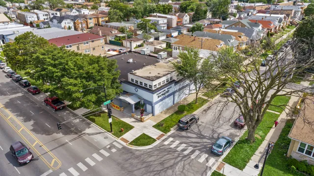 an aerial view of a house with a garden
