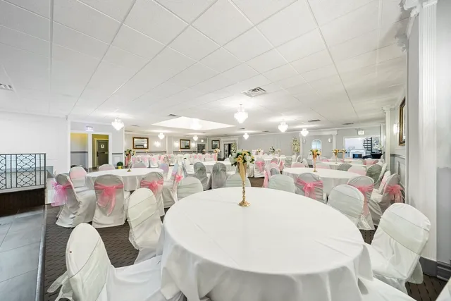 a living room with lots of furniture and a chandelier