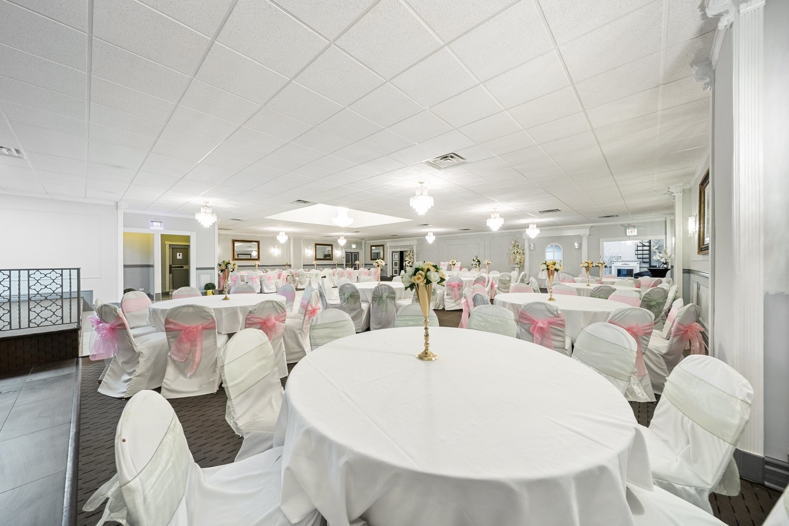 6155 West Fullerton Avenue Chicago, IL 60639 - Photo 10 of 43 a living room with lots of furniture and a chandelier