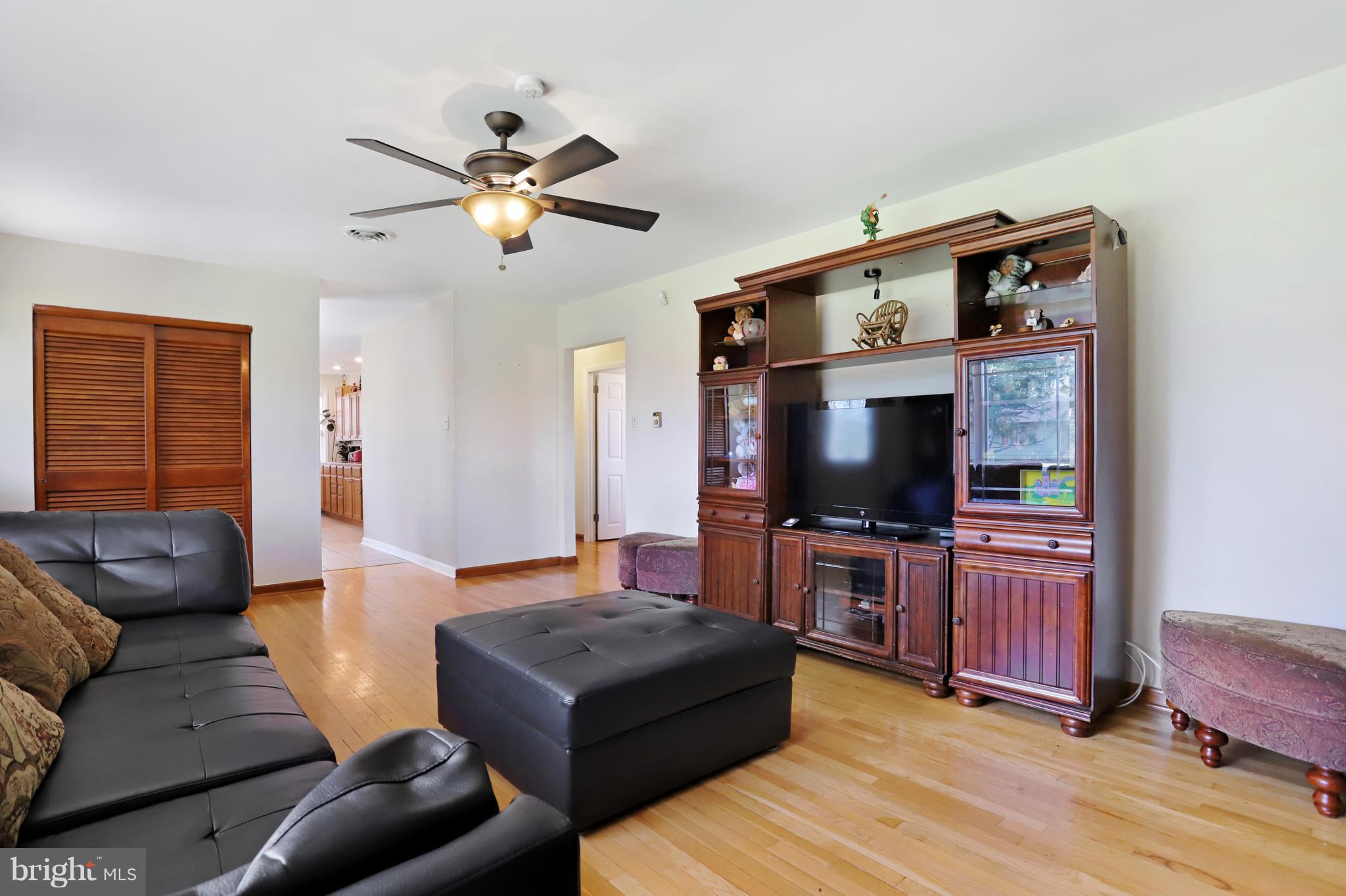 48 Thomas Jefferson Circle Ranson, WV 25438 - Photo 11 of 30 a living room with furniture and a flat screen tv