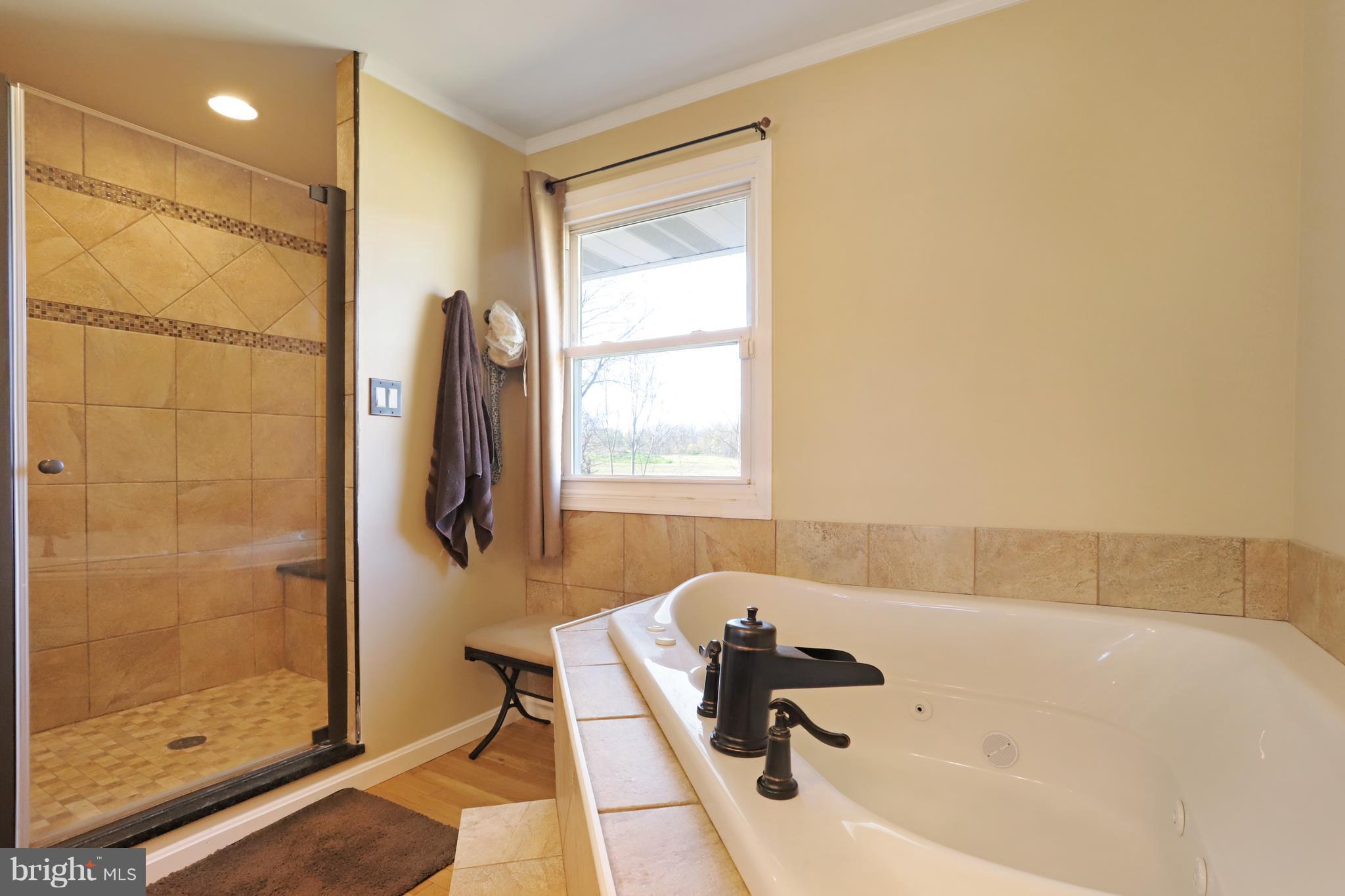 48 Thomas Jefferson Circle Ranson, WV 25438 - Photo 16 of 30 a bathroom with a tub and shower