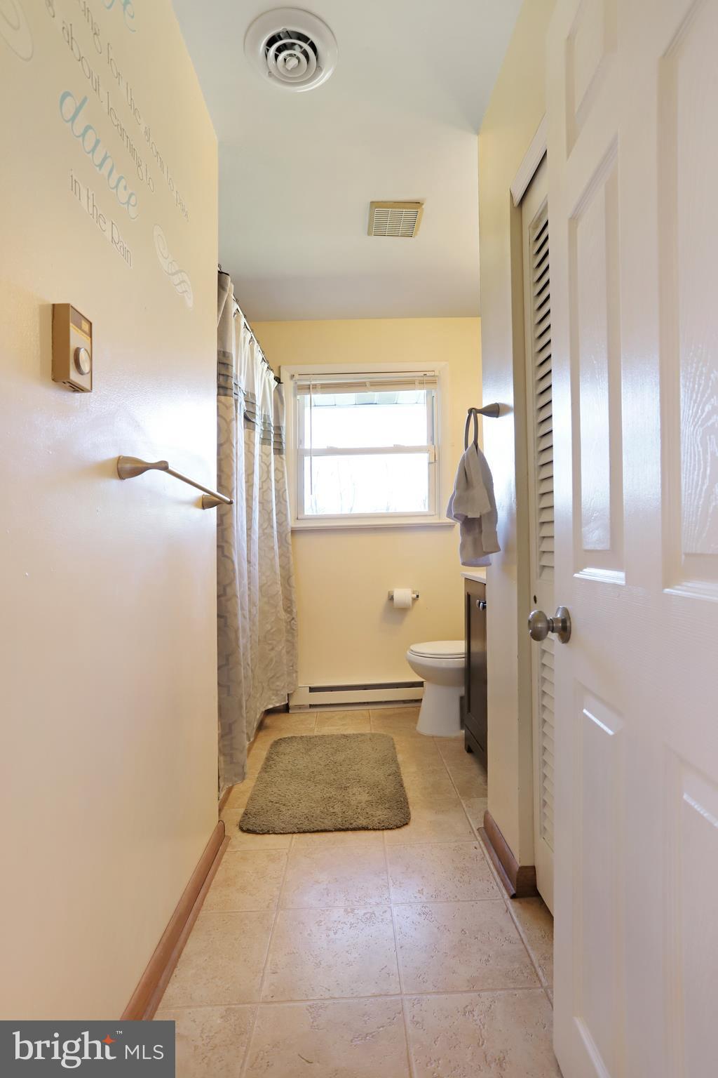 48 Thomas Jefferson Circle Ranson, WV 25438 - Photo 17 of 30 a bathroom with a granite countertop sink and a mirror