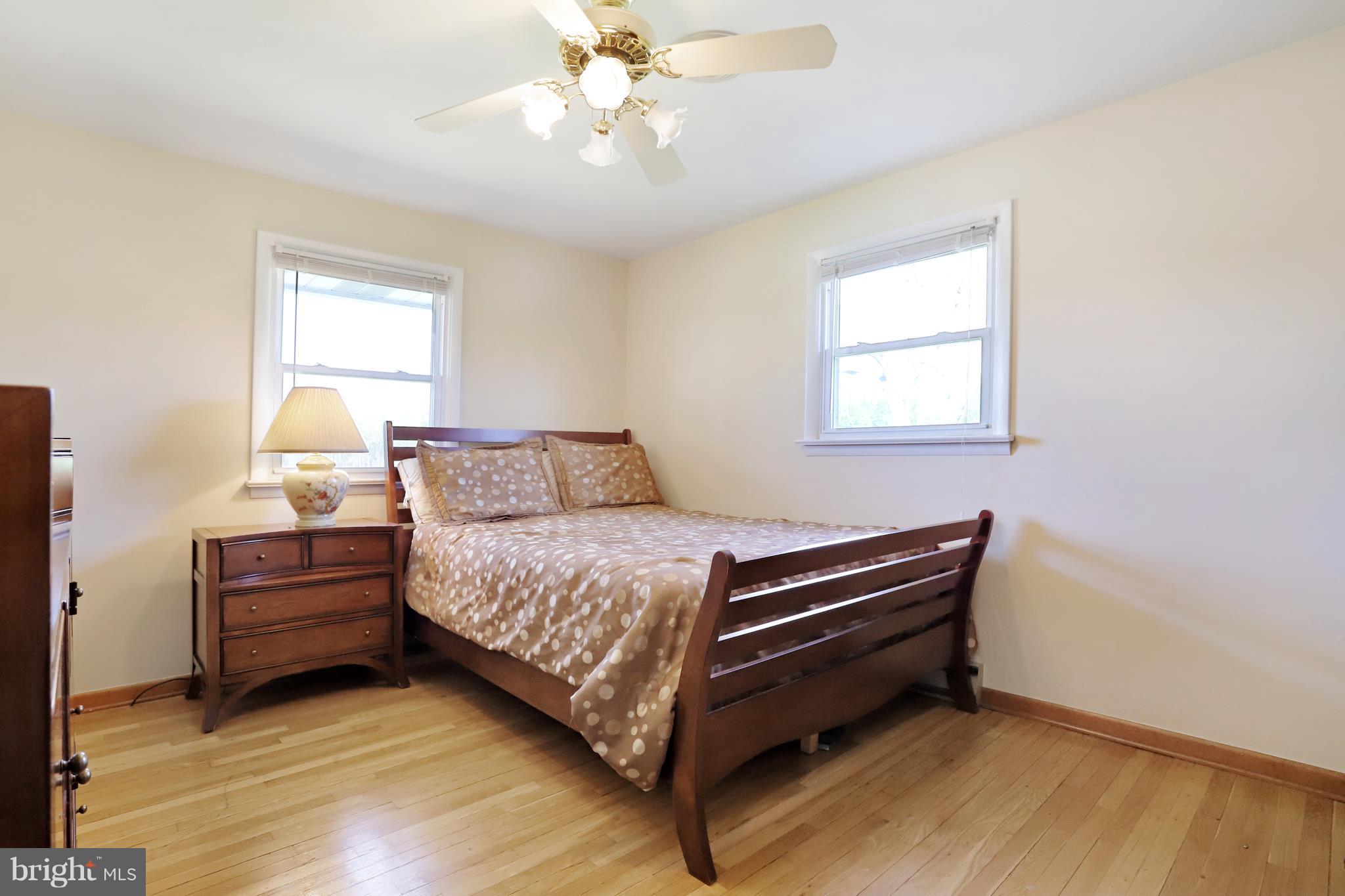 48 Thomas Jefferson Circle Ranson, WV 25438 - Photo 21 of 30 a bedroom with a bed and a chandelier