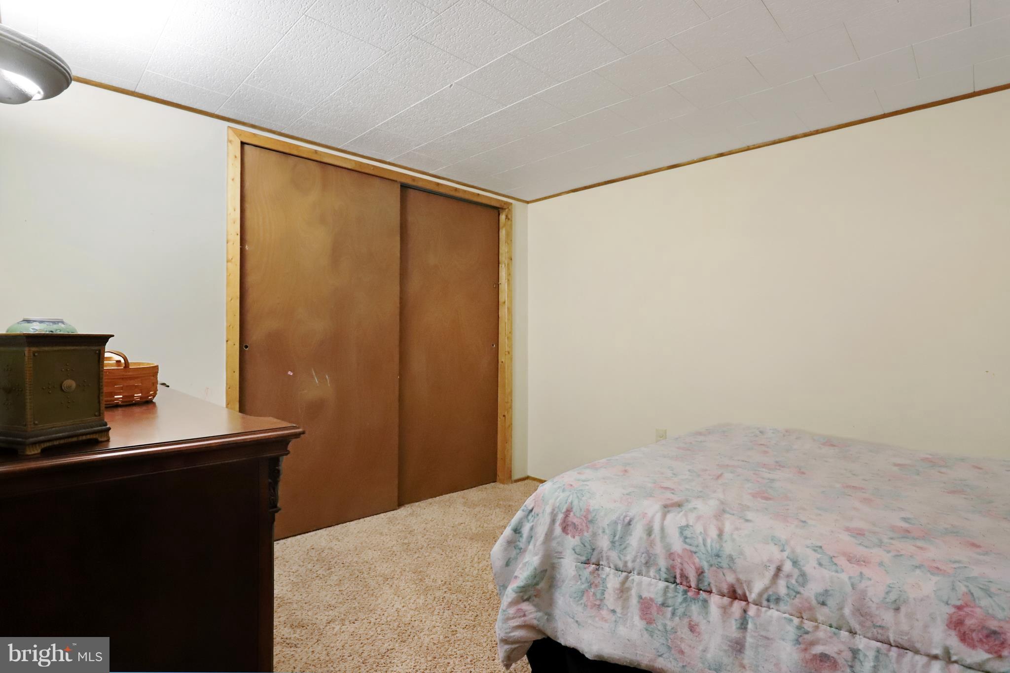 48 Thomas Jefferson Circle Ranson, WV 25438 - Photo 29 of 30 a bedroom with a bed and a flat screen tv