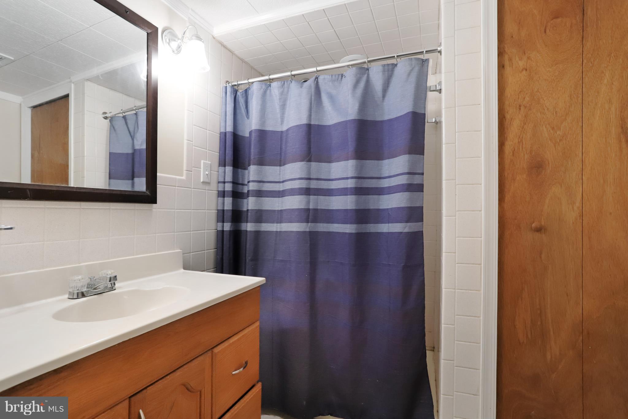 48 Thomas Jefferson Circle Ranson, WV 25438 - Photo 30 of 30 a bathroom with a sink and a mirror