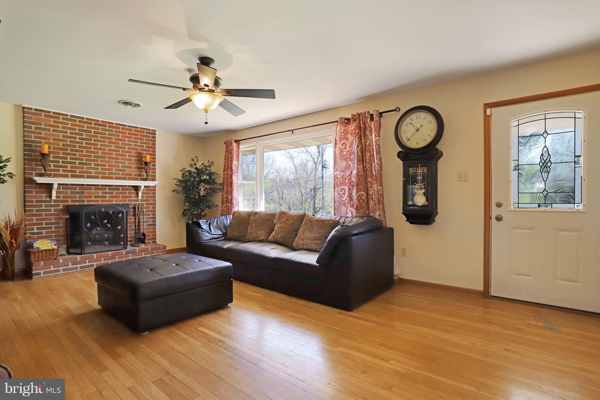 48 Thomas Jefferson Circle Ranson, WV 25438 - Photo 10 of 30 a living room with furniture and a fireplace