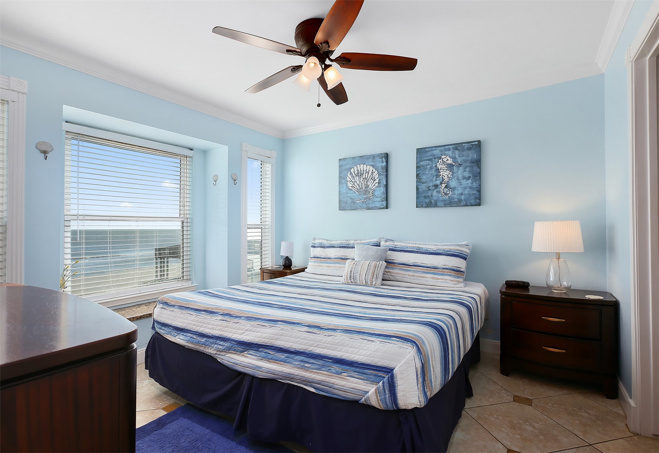 10811 Termini-San Luis Pass Road, Unit 2112 Galveston, TX 77554 - Photo 13 of 22 a bedroom with a bed and a window