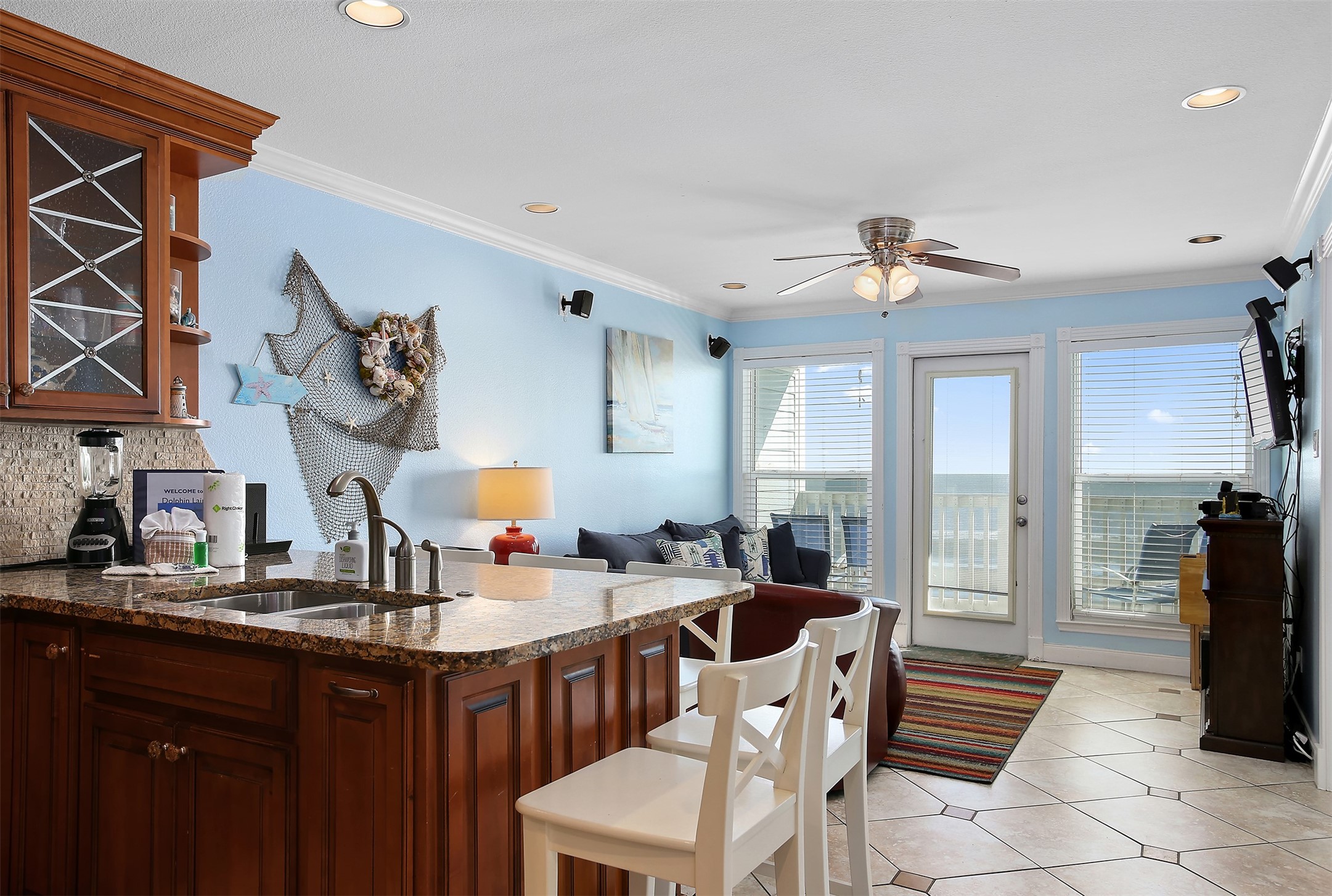10811 Termini-San Luis Pass Road, Unit 2112 Galveston, TX 77554 - Photo 2 of 22 a kitchen with stainless steel appliances granite countertop a sink a stove and a refrigerator
