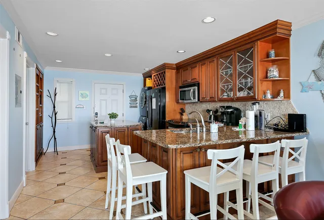 a dinning table and chairs in a kitchen