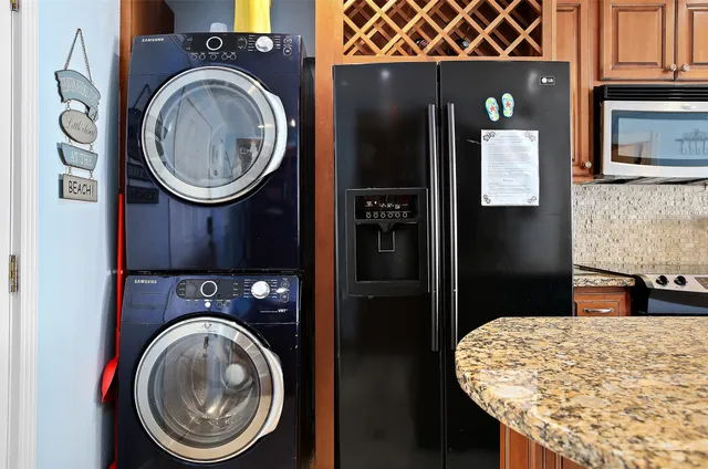 a kitchen with a refrigerator and a stove