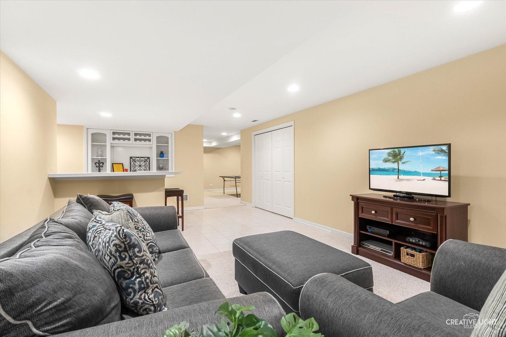 2543 Dewes Lane Naperville, IL 60564 - Photo 17 of 47 a living room with furniture and a flat screen tv