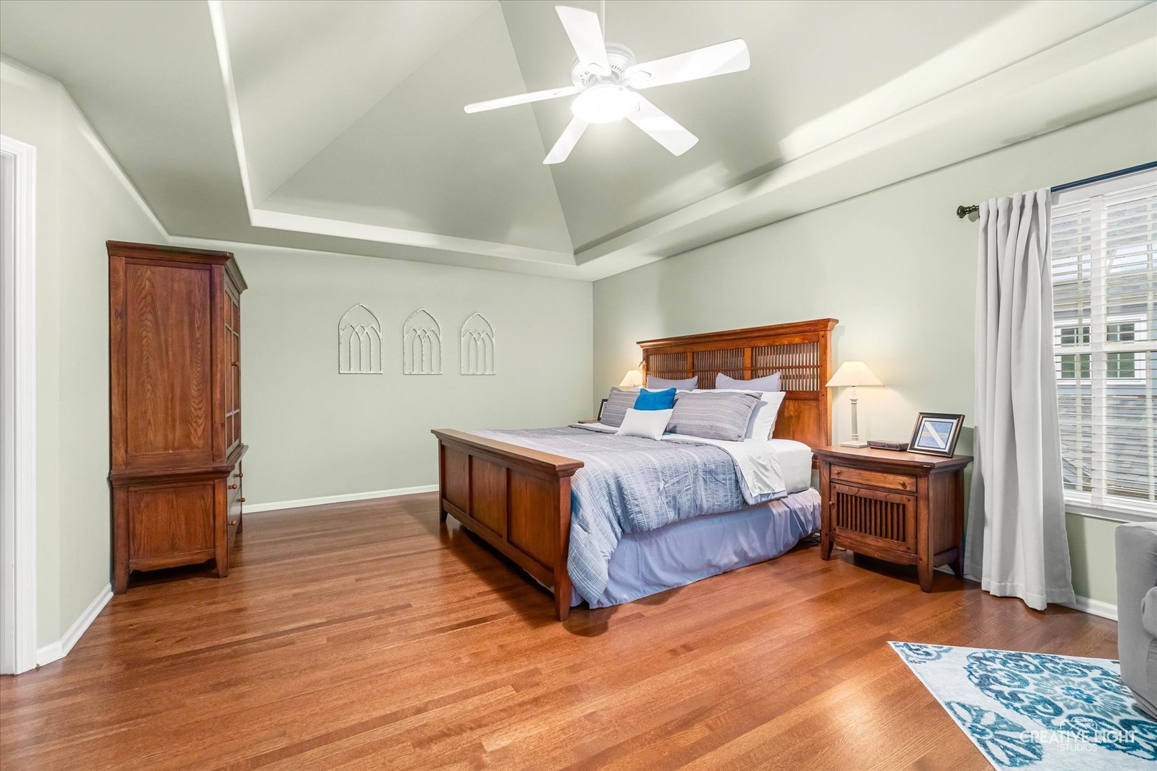 2543 Dewes Lane Naperville, IL 60564 - Photo 24 of 47 a bedroom with a bed and wooden floor