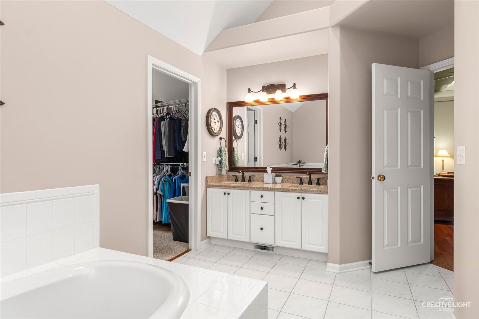 2543 Dewes Lane Naperville, IL 60564 - Photo 27 of 47 a spacious bathroom with a granite countertop sink and a mirror