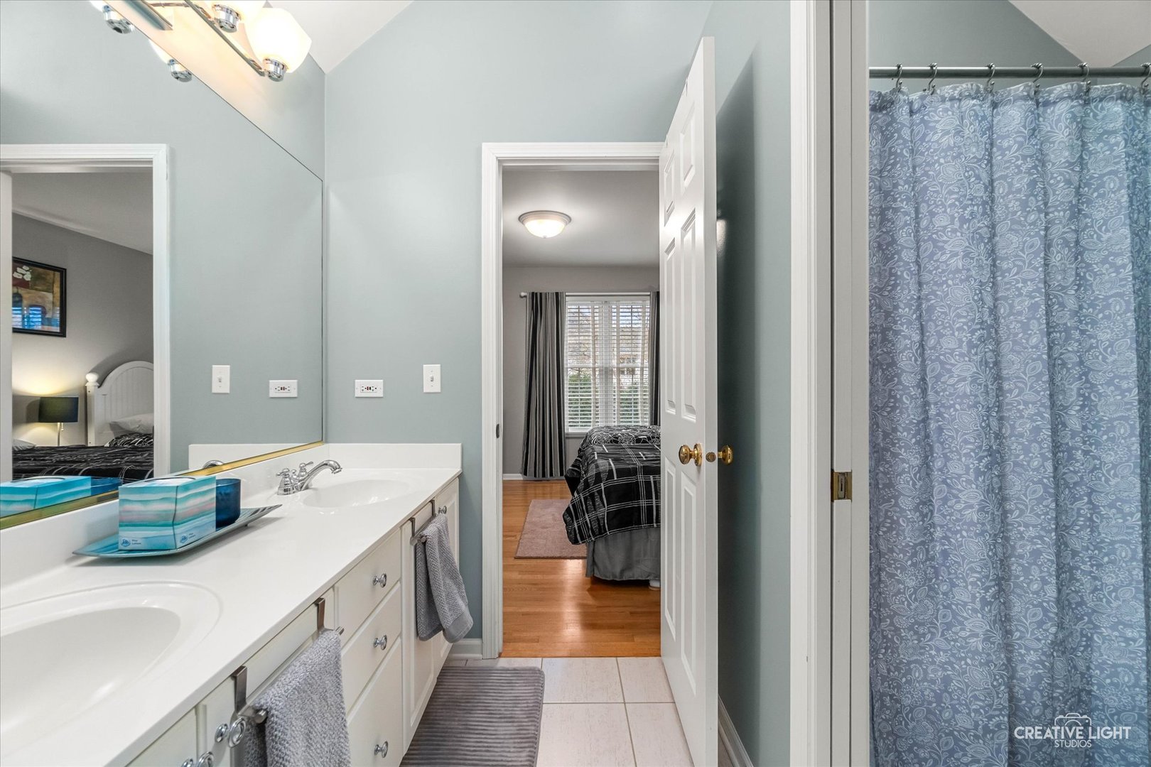 2543 Dewes Lane Naperville, IL 60564 - Photo 33 of 47 a en suite bathroom with a double vanity sink a mirror and shower
