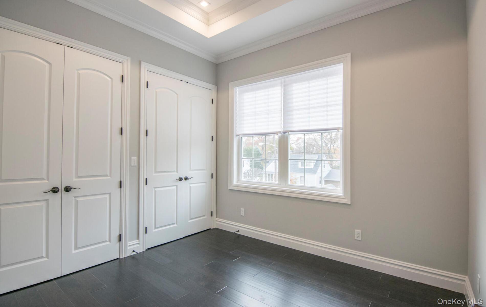2 Seaman Road Glen Cove, NY 11542 - Photo 7 of 17 Second bedroom hardwood floors and custom double door closets. 11 ft ceilings.