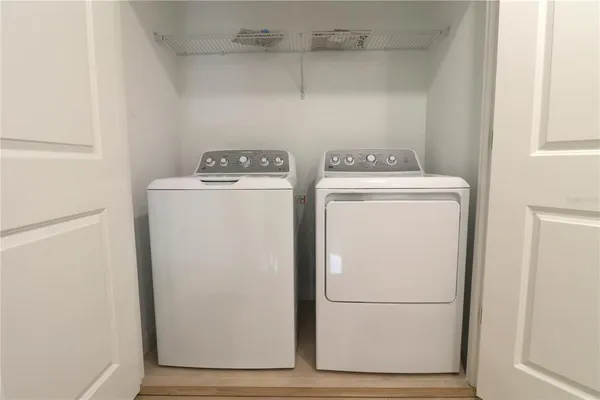 a utility room with dryer and washer