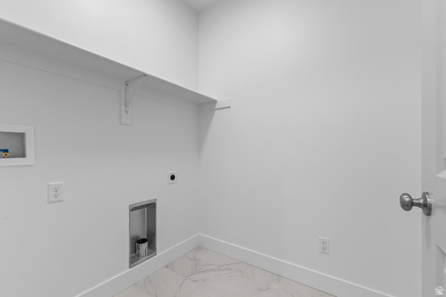 5644 Ibis Road Tooele, UT 84074 - Photo 11 of 19 Dedicated laundry area featuring a white storage shelf, white walls, and a white door with a brushed nickel knob