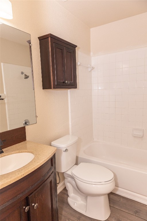 184 Unity Kyle, TX 78640 - Photo 25 of 33 Full bath featuring shower / bath combination, vanity, and dark wood-style floors