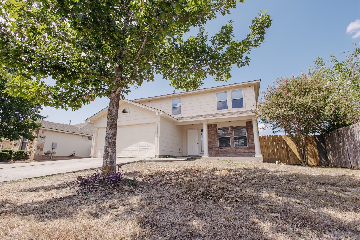 184 Unity Kyle, TX 78640 - Photo 32 of 33 Traditional home with concrete driveway, a garage, and brick siding