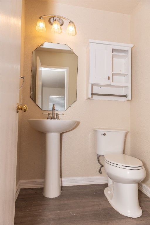 184 Unity Kyle, TX 78640 - Photo 8 of 33 Half bathroom featuring dark wood-style floors and baseboards