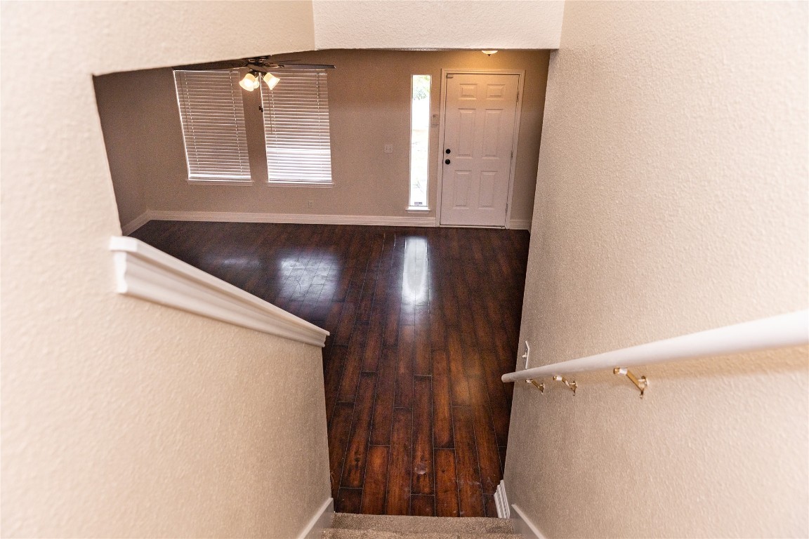184 Unity Kyle, TX 78640 - Photo 10 of 33 Foyer featuring a textured wall, wood finished floors, and a ceiling fan