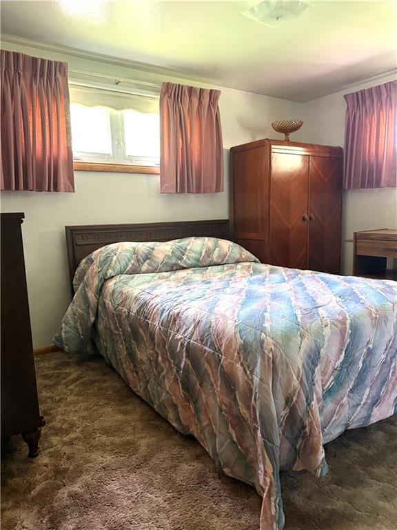 151 Huntingdon Road Wyano, PA 15695 - Photo 23 of 36 a bed sitting in a bedroom next to a window