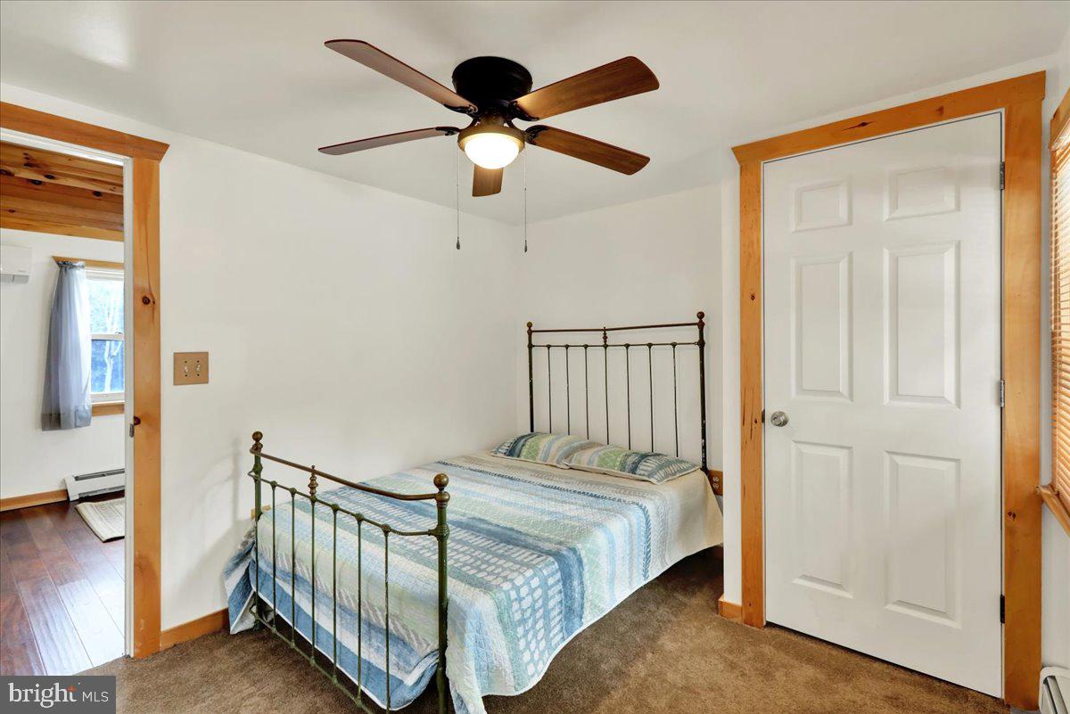 65 Mexico Road Pine Grove, PA 17963 - Photo 21 of 40 a bedroom with a bed and a ceiling fan