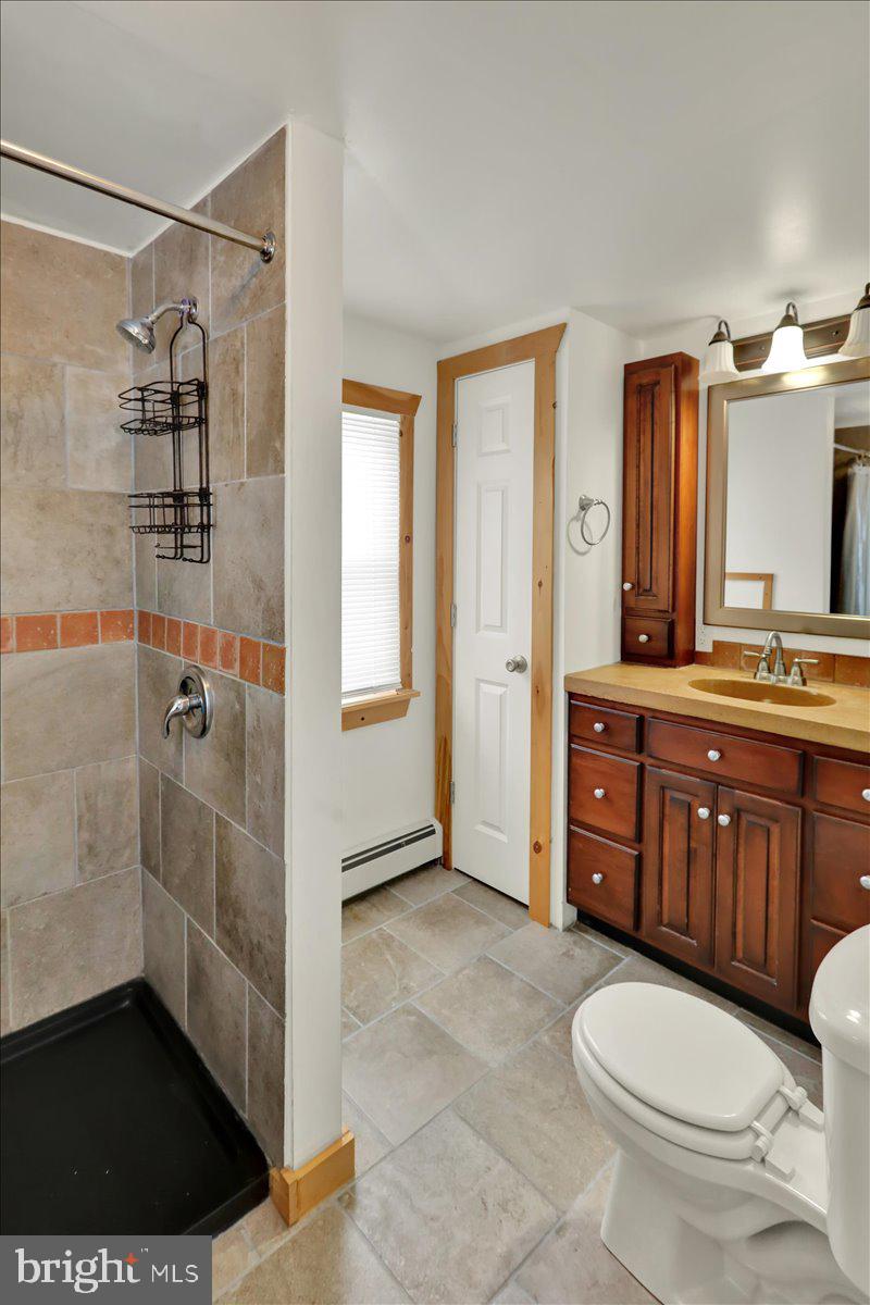 65 Mexico Road Pine Grove, PA 17963 - Photo 26 of 40 a bathroom with a granite countertop sink toilet and shower