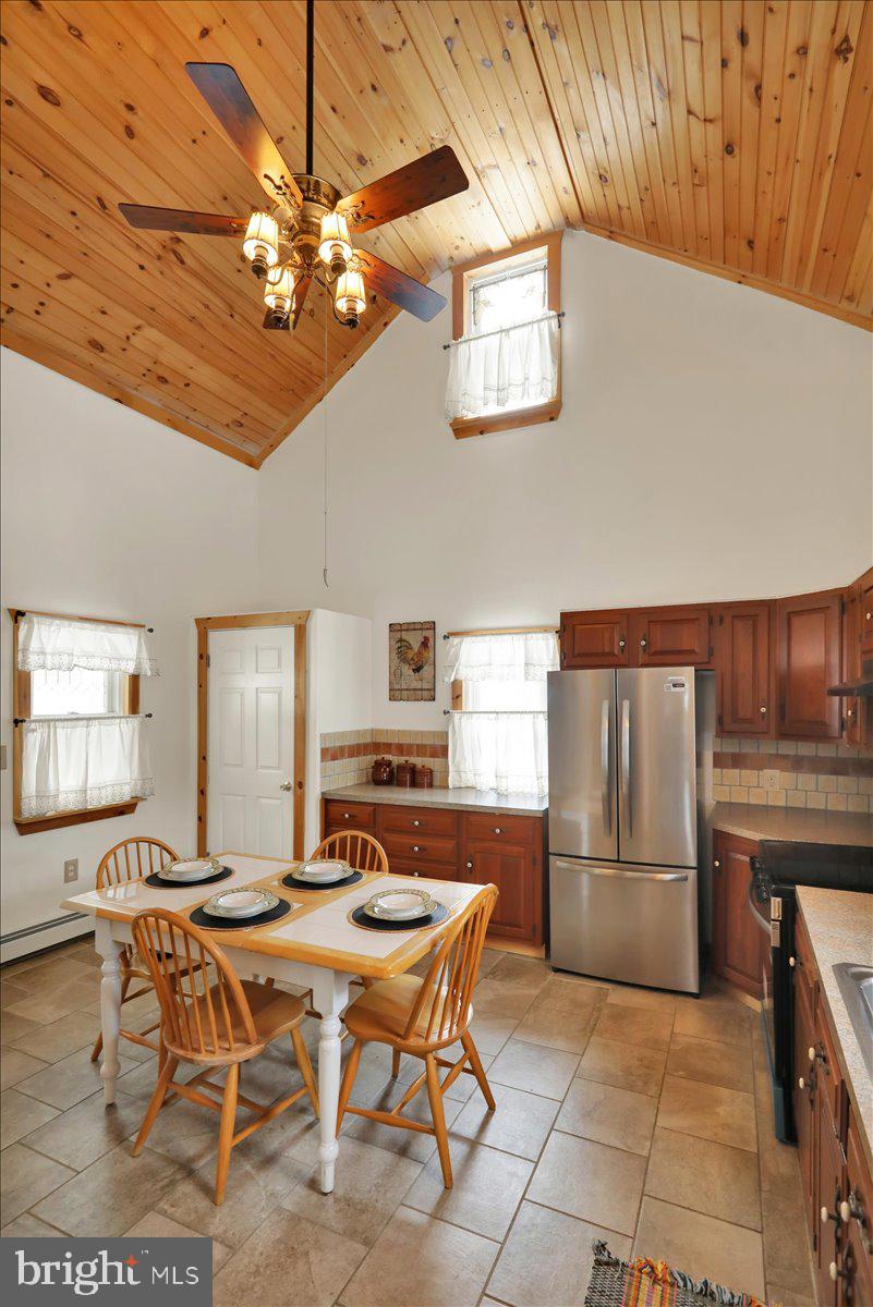 65 Mexico Road Pine Grove, PA 17963 - Photo 7 of 40 a kitchen with a dining table and chairs