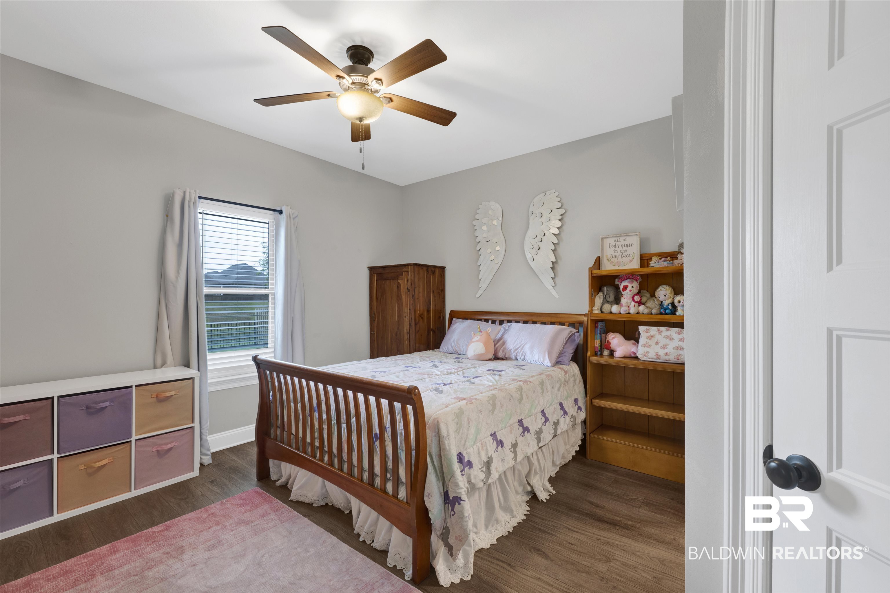 12672 Squirrel Drive Daphne, AL 36527 - Photo 33 of 49 Bedroom featuring wood-finish flooring, a window with blinds, and a ceiling fan with integrated lighting
