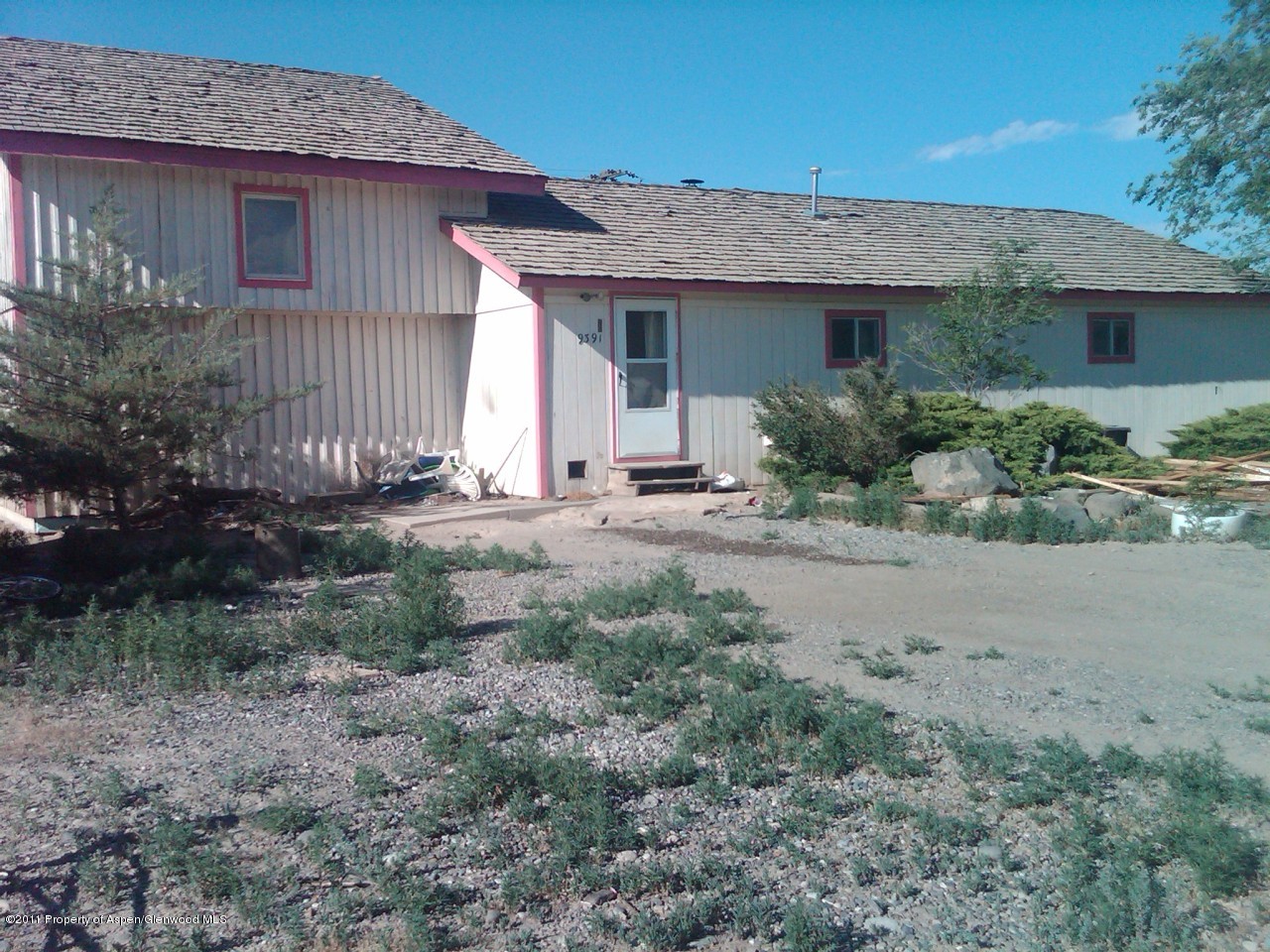 9391 2125 Road Austin, CO 81410 - Photo 1 of 1 a front view of a house with a yard
