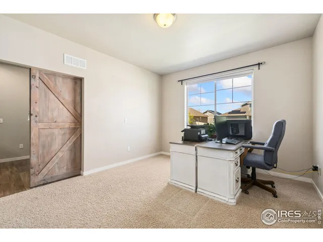 a workspace with furniture and a window