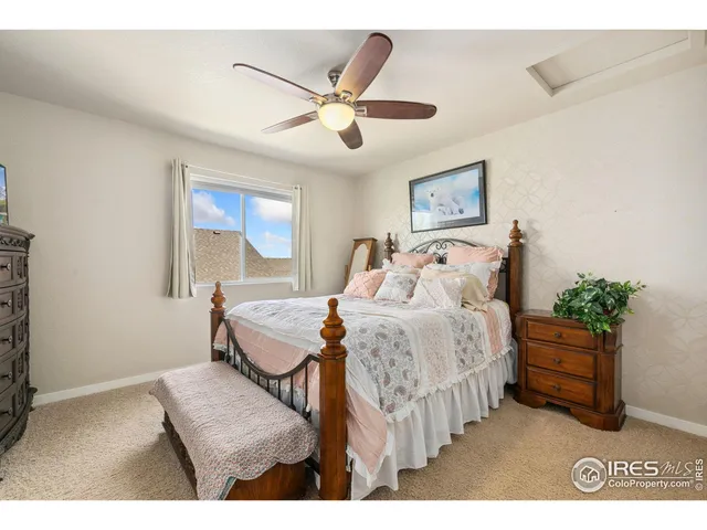 a bedroom with bed and window