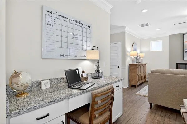a kitchen with granite countertop a sink dishwasher stove and cabinets