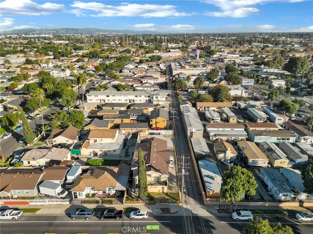 an aerial view of residential building with parking