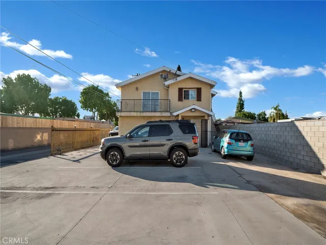 a view of a cars parked in front of a house