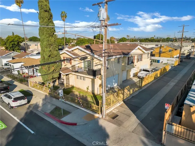 an aerial view of residential houses with outdoor space