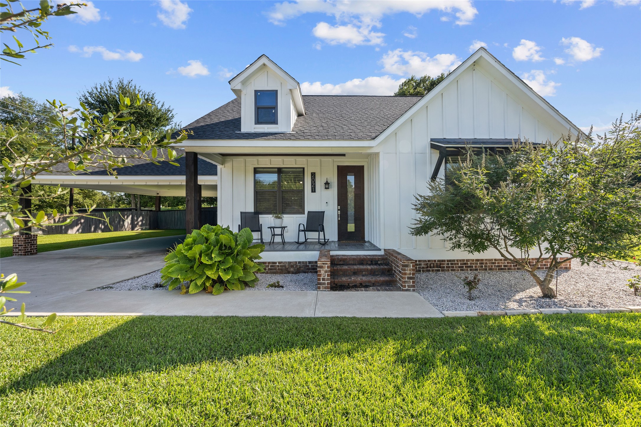 2021 Strangmeier Road Brenham, TX 77833 - Photo 1 of 16 Welcome to your very own beautiful modern style farmhouse featuring a welcoming front porch, covered carport and attractive landscaping.